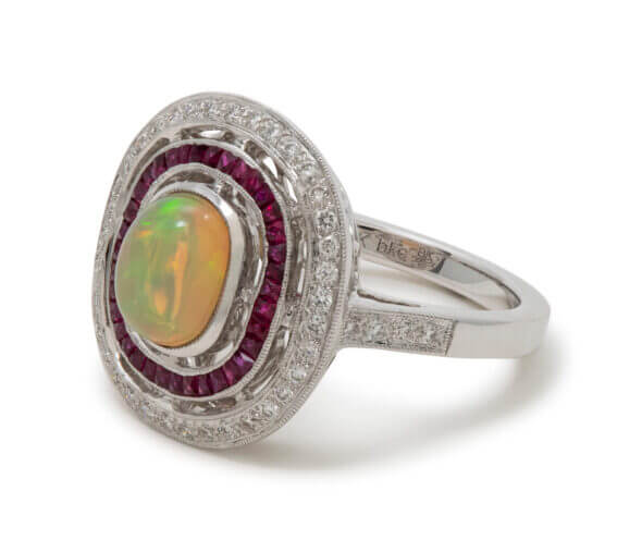 18 Karat White Gold Opal, Ruby and Diamond Halo Ring side view