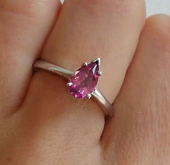 14 Karat White Gold Pear Shaped Pink Tourmaline Solitaire Ring on finger