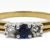 Platinum and 18 Karat Yellow Gold Sapphire and Diamond Three Stone Ring