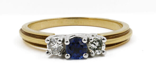 Platinum and 18 Karat Yellow Gold Sapphire and Diamond Three Stone Ring