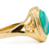 14 Karat yellow gold bezel set Opal Ring with diamond accents side view