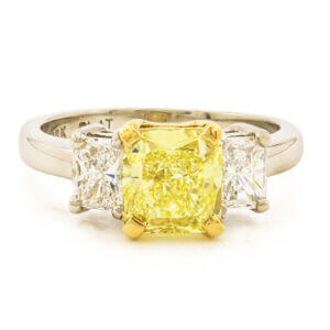 1.87 Carat Fancy Intense Yellow Diamond Ring with 2 Radiant Cut Accent Diamonds in Platinum | 18 Karat Yellow Gold front view