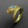 18 Karat Yellow Gold Snake ring with Opal and Diamonds