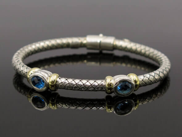 Silver and 18 Karat Yellow Gold Weave Bracelet with Bezel Set Topaz front view