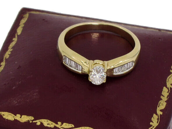 14 Karat Yellow Gold Oval and Baguette Diamond Ring front view