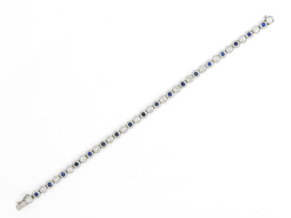 14 Karat White Gold Alternating Sapphire and Diamond Bubble Band laying open