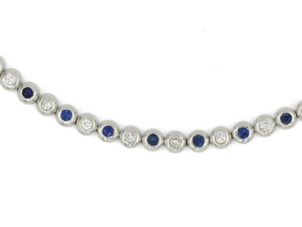 14 Karat White Gold Alternating Sapphire and Diamond Bubble Band lying flat zoomed in