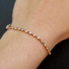 14 Karat Rose Gold Bezel Set Diamond Bracelet on hand