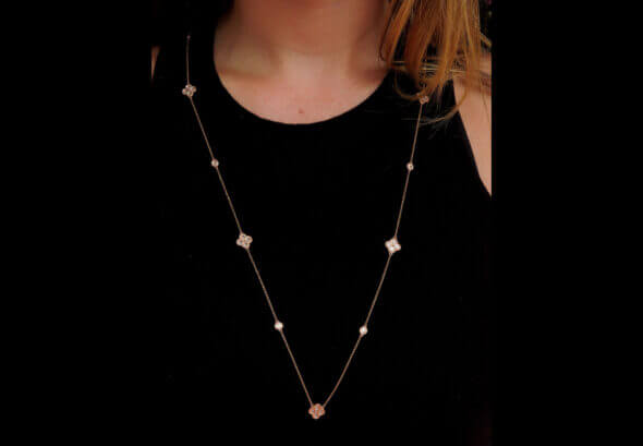 32 Inch 14 Karat Rose Gold Diamond Cluster Necklace on neck