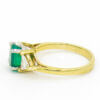 14 Karat Yellow and White Gold Emerald and Trillion Cut Diamond Ring side view