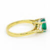 14 Karat Yellow and White Gold Emerald and Trillion Cut Diamond Ring side view