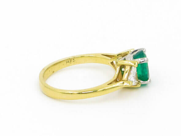 14 Karat Yellow and White Gold Emerald and Trillion Cut Diamond Ring side view