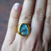 18 Karat Yellow Gold Freeform Bezel Set Opal Ring on hand
