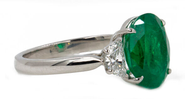 Platinum 4.07 carat oval Colombian Emerald with Half Moon Shaped diamonds, side view