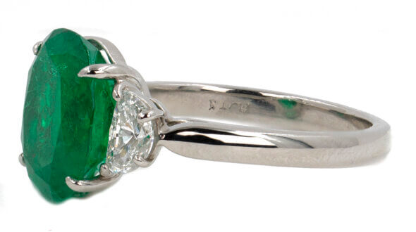 Platinum 4.07 carat oval Colombian Emerald with Half Moon Shaped diamonds, side view