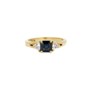18 Karat Yellow Gold Square Emerald Cut Sapphire and Trillion Diamond Ring